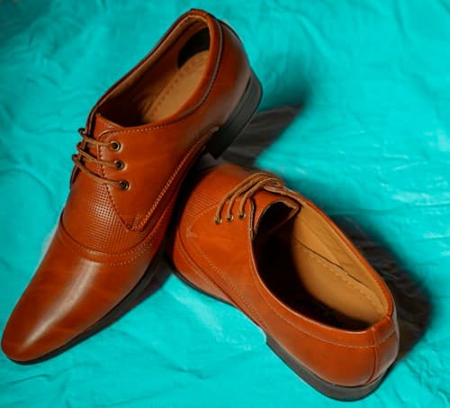 Brown leather footwear